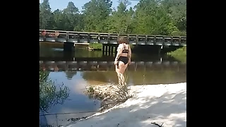 public peeing outside summer on the river